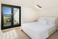 image of master bedroom of holiday apartment manly